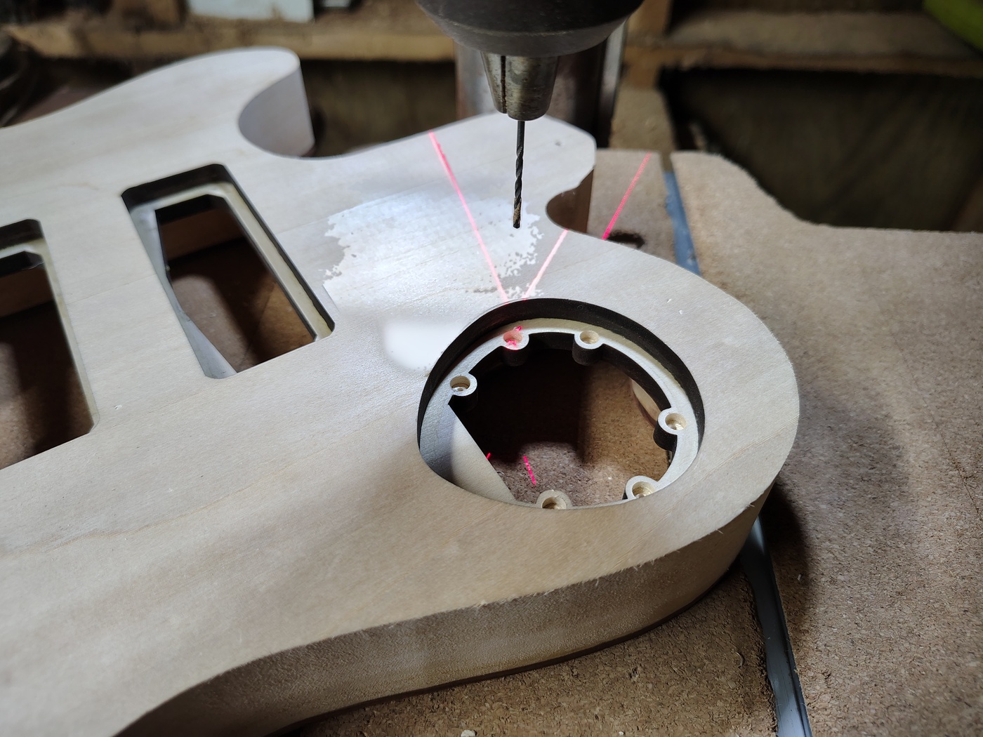 Drilling holes in center of
magnet recesses