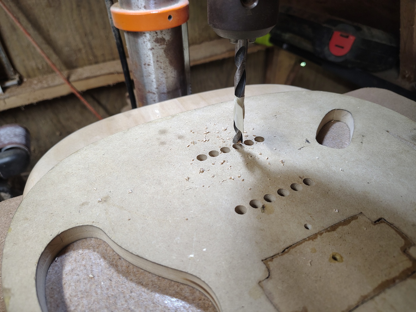 Drilling the string ferrule
holes using a template