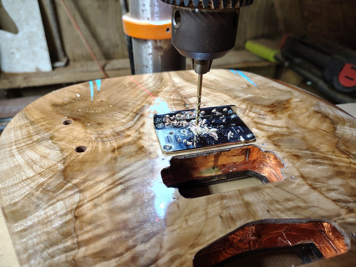 Using the bridge as a guide to
drill string through body holes