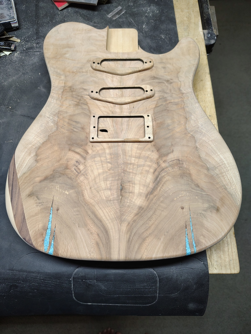 Top of the guitar with arm
cut and pickup mounting rings
